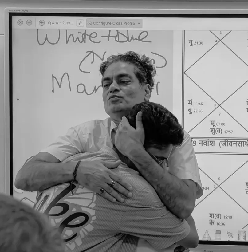 Mitra Guru Shri Brajesh Gautam Ji offering Piyush Rajput a comforting embrace